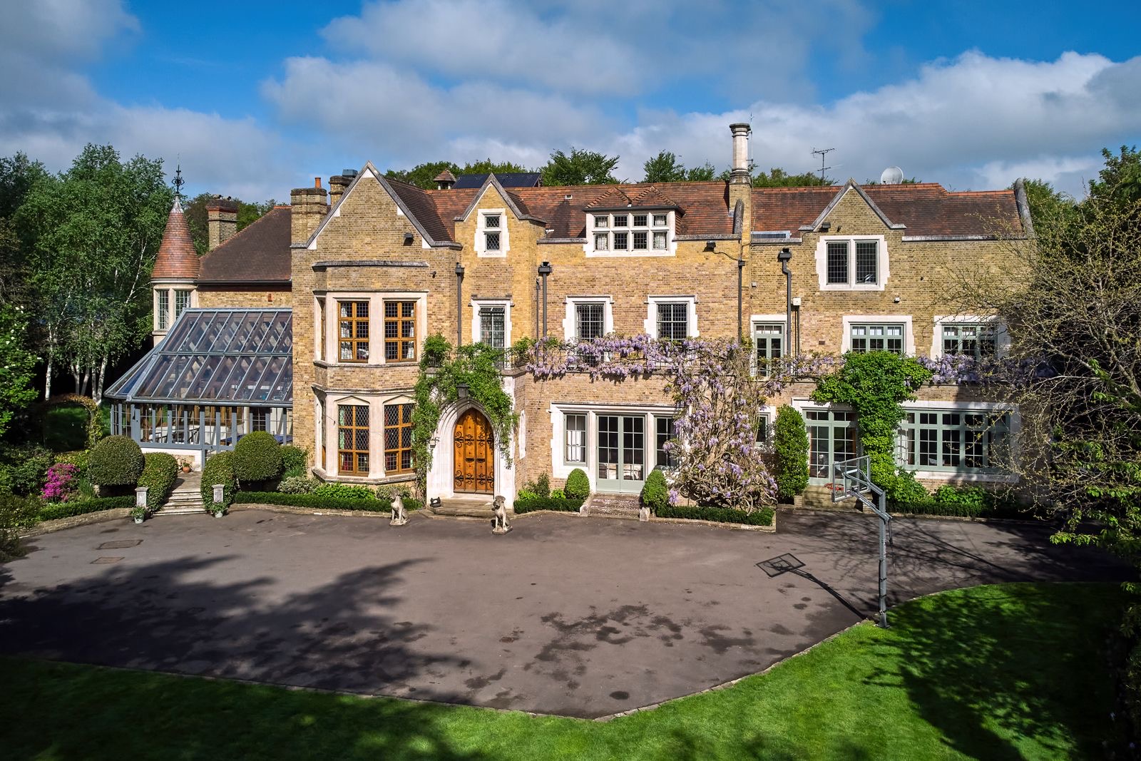 The front of the home with wisteria over the door