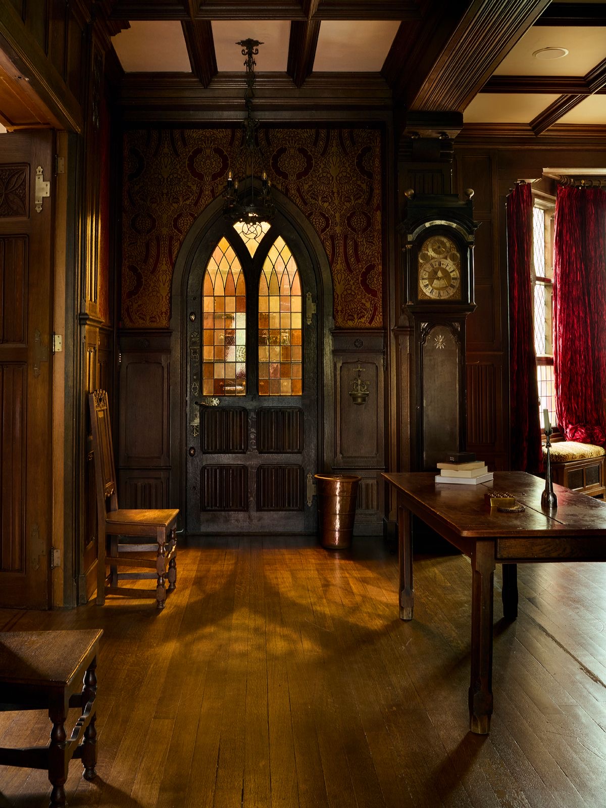 Panelled hall with a Gothic stained-glass door
