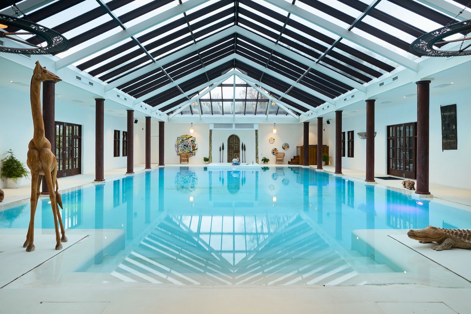 The indoor swimming pool beneath its glass roof